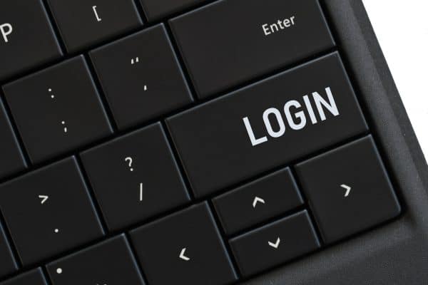 Login button on a computer keyboard for accessing your account online on a website
